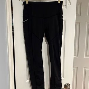 LULULEMON black workout leggings with reflective side